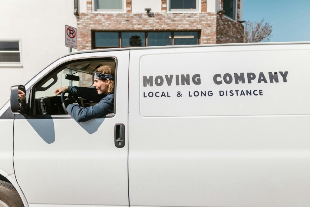 a man in a long distance moving company van 